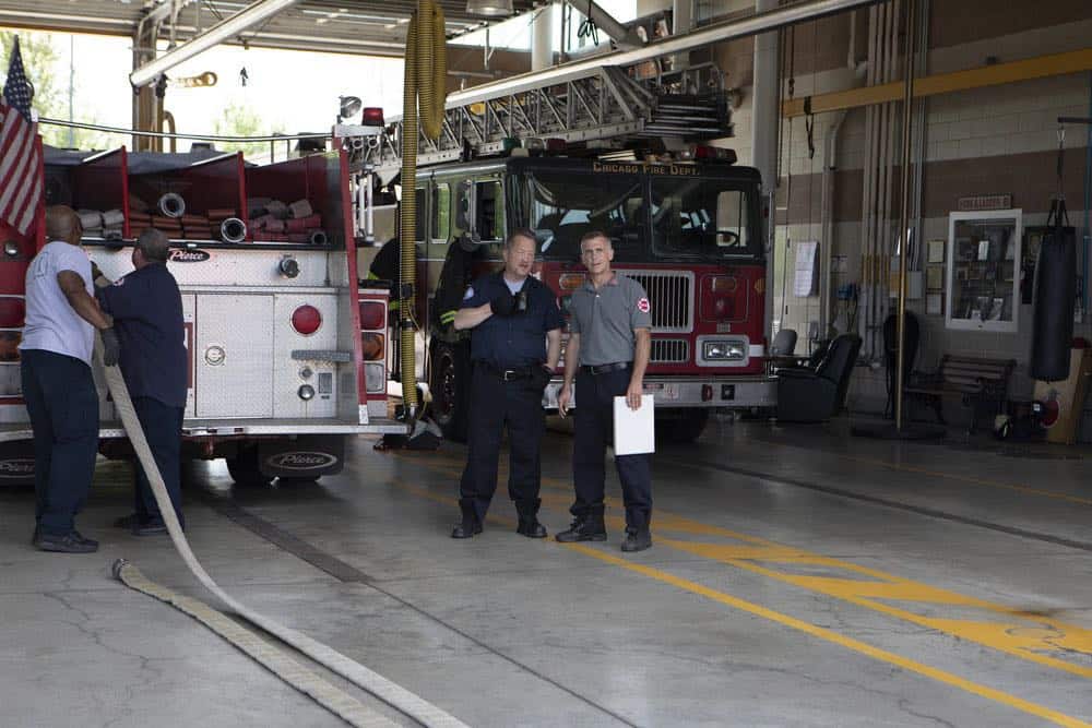 CHICAGO FIRE -- "This Isn't Charity" Episode 704 -- Pictured: (l-r) Christian Stolte as Mouch, David Eigenberg as Christopher Herrmann -- (Photo by: Adrian Burrows/NBC) CHICAGO FIRE -- "This Isn't Charity" Episode 704 -- Pictured: (l-r) Christian Stolte as Mouch, David Eigenberg as Christopher Herrmann -- (Photo by: Adrian Burrows/NBC)