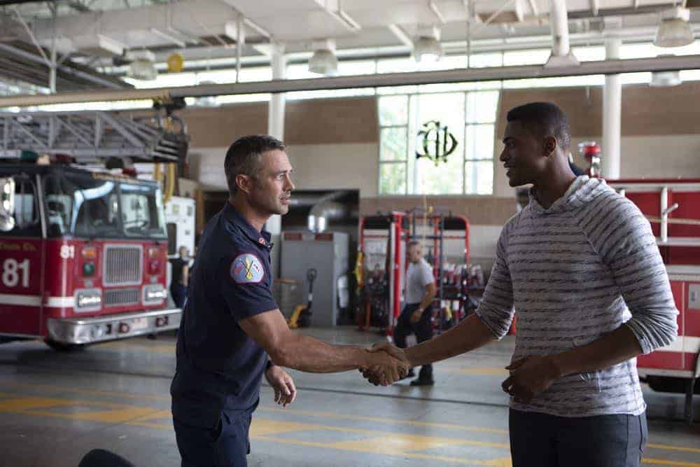 CHICAGO FIRE -- "This Isn't Charity" Episode 704 -- Pictured: (l-r) Taylor Kinney as Kelly Severide, Justin Cornwell as Tyler -- (Photo by: Adrian Burrows/NBC)