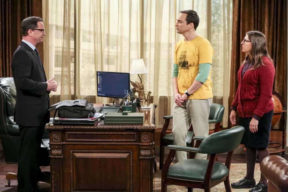 "The Planetarium Collision" -- Pictured: President Siebert (Joshua Malina) , Sheldon Cooper (Jim Parsons) and Amy Farrah Fowler (Mayim Bialik). When Amy doesn't have time to work on super-asymmetry, Sheldon goes to great lengths to ensure she's available to work with him even it if means accidentally sabotaging her career in the process. Also, Koothrappali doesn't want Wolowitz to join him in hosting a show at the planetarium, on THE BIG BANG THEORY, Thursday, Oct. 18 (8:00-8:31 PM, ET/PT) on the CBS Television Network. Emmy Award winner Bob Newhart returns as Arthur Jeffries. Photo: Michael Yarish/Warner Bros. Entertainment Inc. é 2018 WBEI. All rights reserved.