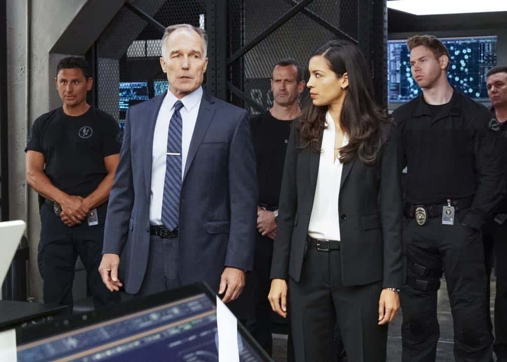 "Saving Face" -- Hondo suspects ulterior motive when the estranged U.S. Marshal husband (Michael Trucco) of his romantic interest, Deputy District Attorney Nia Wells (Nikiva Dionne), requests the S.W.A.T. team's help with the apprehension of a fugitive robbing drug cargo shipments. Also, Jessica is forced to implement departmental budget cuts as Street makes a heartbreaking discovery about his mother Karen (Sherilyn Fenn) on, on S.W.A.T., Thursday, Oct. 18 (10:00-11:00 PM, ET/PT) on the CBS Television Network. Pictured L to R: Patrick St. Esprit as Commander Robert Hicks and Stephanie Sigman as Jessica Cortez. Photo: Bill Inoshita/CBS é2018 CBS Broadcasting, Inc. All Rights Reserved