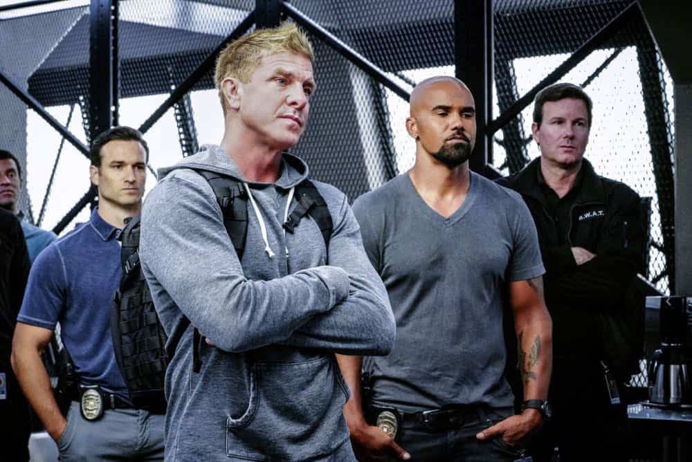 "Saving Face" -- Hondo suspects ulterior motive when the estranged U.S. Marshal husband (Michael Trucco) of his romantic interest, Deputy District Attorney Nia Wells (Nikiva Dionne), requests the S.W.A.T. team's help with the apprehension of a fugitive robbing drug cargo shipments. Also, Jessica is forced to implement departmental budget cuts as Street makes a heartbreaking discovery about his mother Karen (Sherilyn Fenn) on, on S.W.A.T., Thursday, Oct. 18 (10:00-11:00 PM, ET/PT) on the CBS Television Network. Pictured L to R: Kenny Johnson as Dominique Luca, Shemar Moore as Daniel "Hondo" Harrelson. Photo: Bill Inoshita/CBS é2018 CBS Broadcasting, Inc. All Rights Reserved