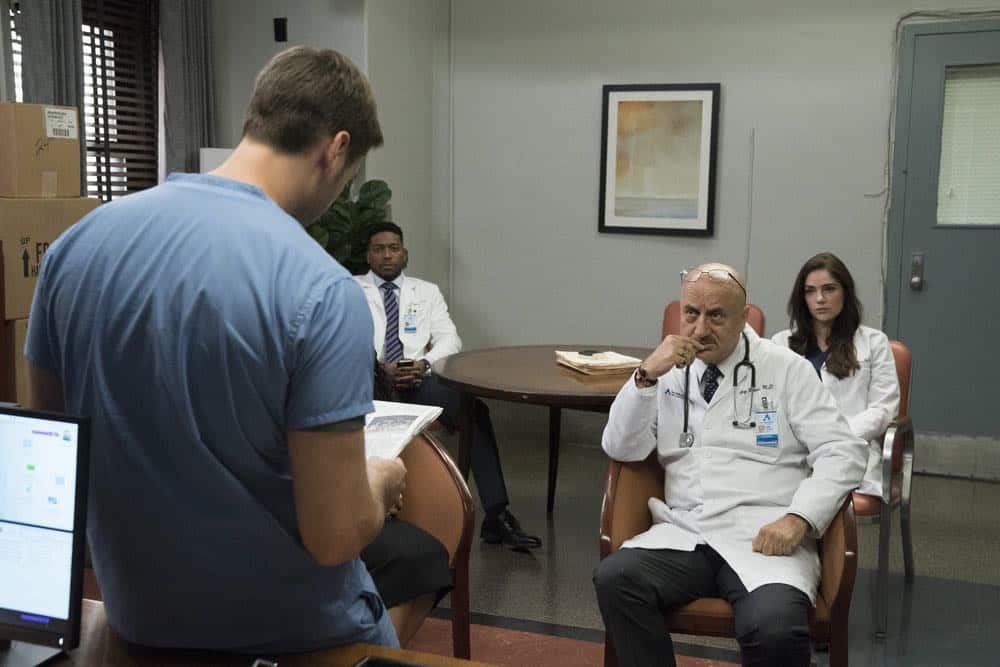 NEW AMSTERDAM -- "Cavitation" Episode 105 -- Pictured: (l-r) Ryan Eggold as Dr. Max Goodwin, Jocko Sims as Dr. Floyd Reynolds, Anupam Kher as Dr. Vijay Kapoor, Janet Montgomery as Dr. Lauren Bloom -- (Photo by: Virginia Sherwood/NBC) NEW AMSTERDAM -- "Cavitation" Episode 105 -- Pictured: (l-r) Ryan Eggold as Dr. Max Goodwin, Jocko Sims as Dr. Floyd Reynolds, Anupam Kher as Dr. Vijay Kapoor, Janet Montgomery as Dr. Lauren Bloom -- (Photo by: Virginia Sherwood/NBC)