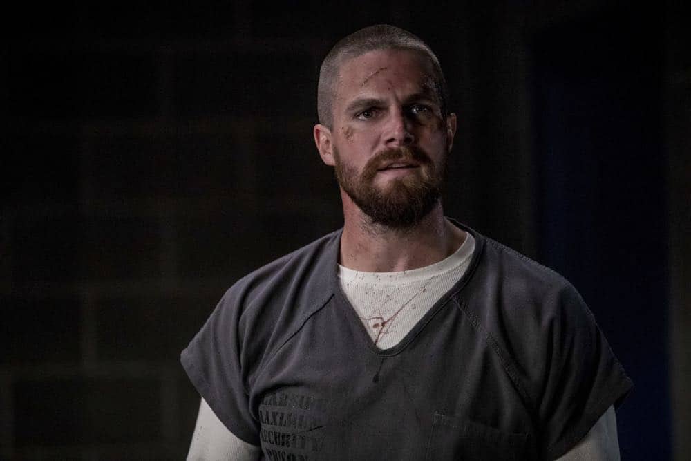 Arrow -- "Crossing Lines" -- Image Number: AR703a_0256b -- Pictured: Stephen Amell as Oliver Queen/Green Arrow -- Photo: Jack Rowand/The CW -- é 2018 The CW Network, LLC. All Rights Reserved.